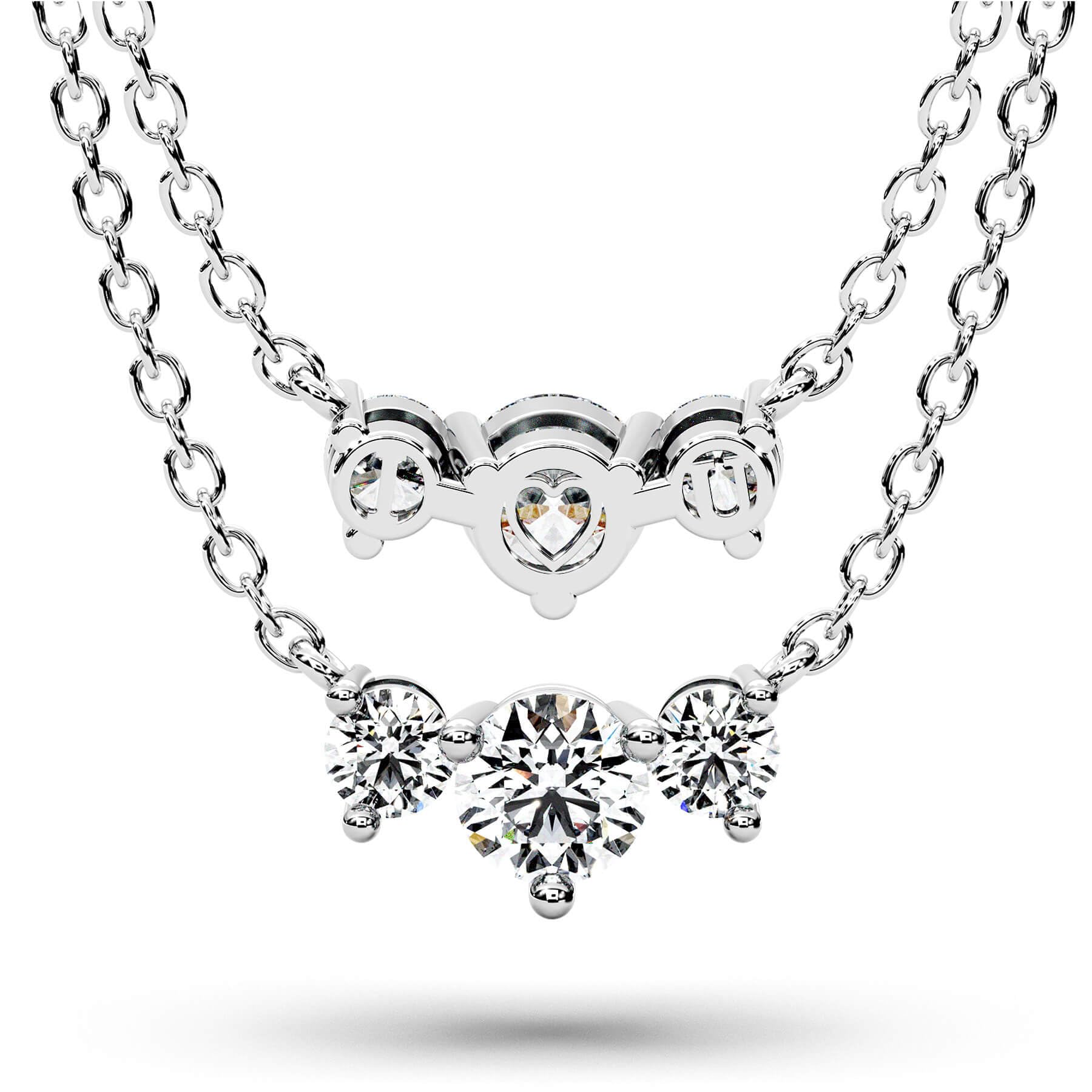 A silver-tone double-strand necklace featuring a top heart-shaped clasp with a central round gemstone and a lower cluster of three round-cut gemstones, shown on a white background with a soft shadow.